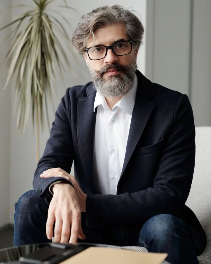 Daniel Rowe, partner and mediator, seated in a light-filled room